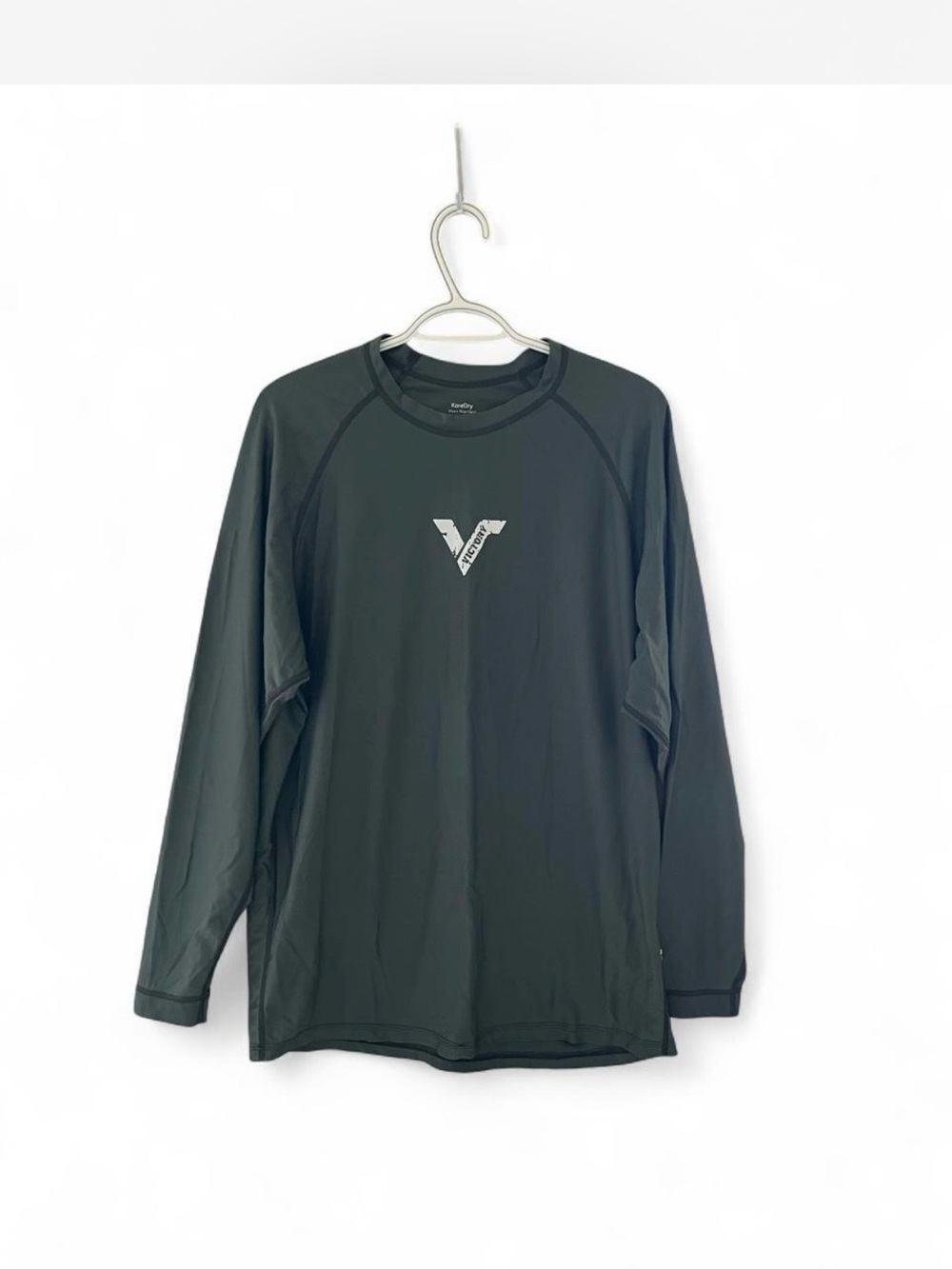 Victory Wear long sleeve shirt in green & white logo. Water resistant technology